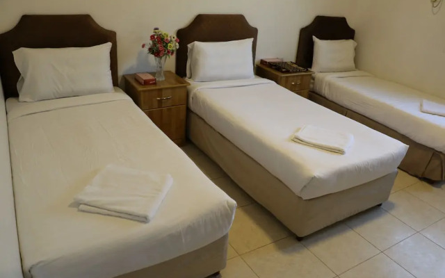 Al Alya Hotel Rooms and Suites